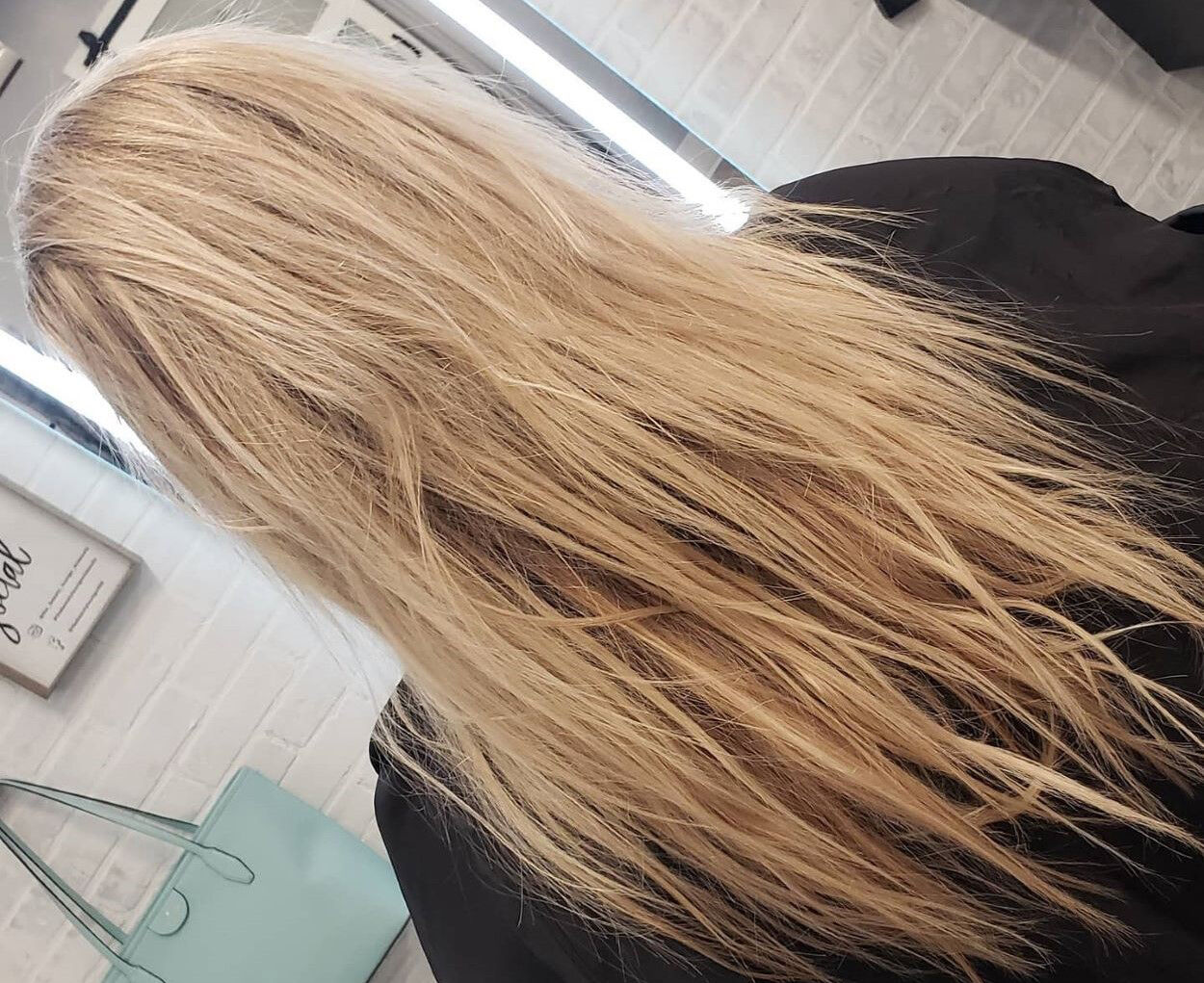 A detailed look at blonde hair exhibiting signs of damage and dryness, in need of repair.